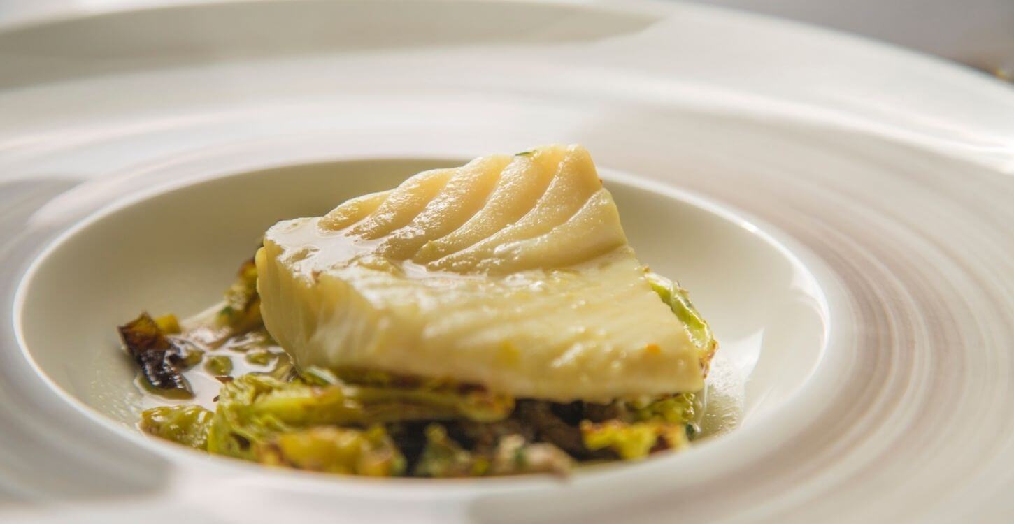 Striped Bass Braised in Mussel Liquor with Brussel Sprouts, Cabbage and Fresno Chili