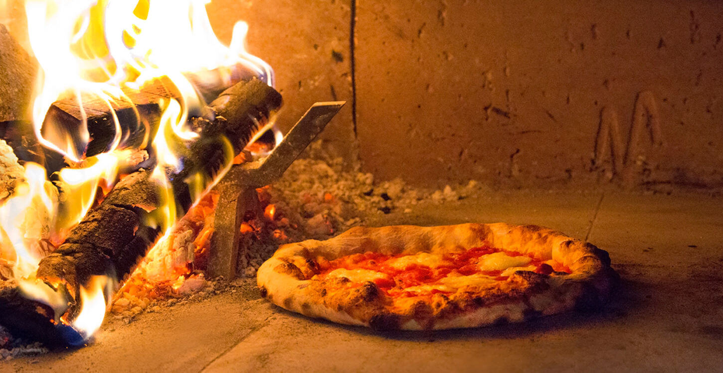 Wood fired pizza in Mugnaini oven